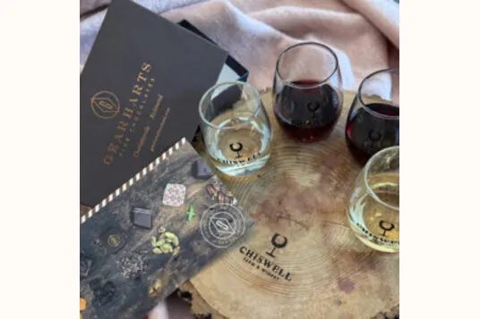 A Gearharts chocolate box beside a flight of Chiswell wines