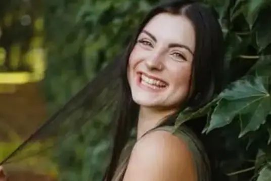 Singer Rebecca Romano smiling outdoors