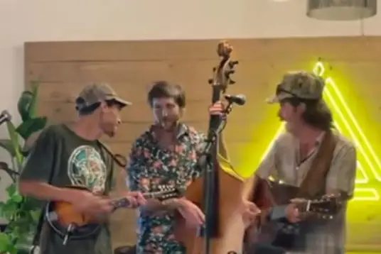 Creek Mill Grass playing mandolin, upright bass and guitar
